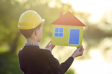 Boy dreams of a house. house concept.