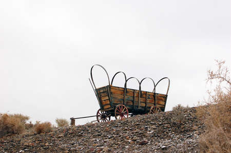 Old Covered Wagon on a hillの写真素材