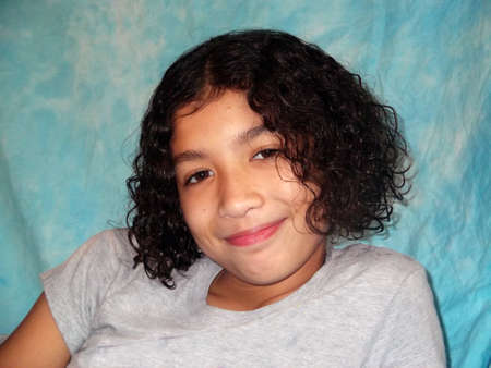 Close up of curly haired childs faceの写真素材