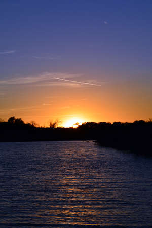 Vertical Sunset over the lakeの写真素材