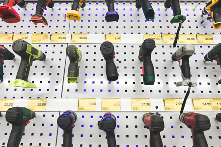 Background. Showcase with screwdrivers in store. Selection and purchase of repair tools. Many screwdrivers frontal picture above.の写真素材