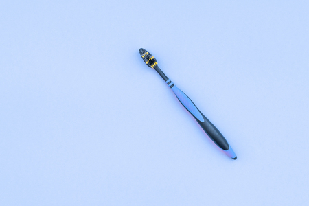 Ttoothbrush is on a blue background, a view from above. Copyspace. Flat lay. Dental Care Concept.の写真素材
