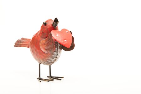 Red bird with a red heartの写真素材