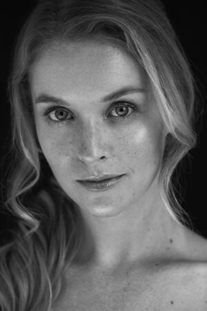 Black and white professional portrait with a beautiful woman in a photo studio.の写真素材