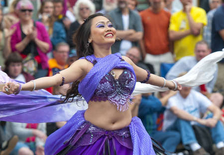 SEATTLE, WA - JUNE 16, 2012: A participant dances of the annual Fremont Summer Solstice Day Parade on June 16, 2012 in Seattle. This event is dedicated to celebrate the beginning of the summer.のeditorial素材