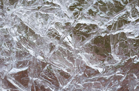 Ice on the lake surface forms beautiful pattern