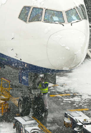 LONDON - JANUARY 18, 2013: Aircraft in the snowstorm at Heathrow airport on January 18, 2013 in...