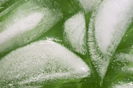 Ice cubes in a green drink close upの写真素材