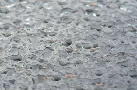 Rain water drops on glass surface