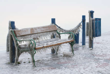 Icicles on a bench of a landing stageの写真素材