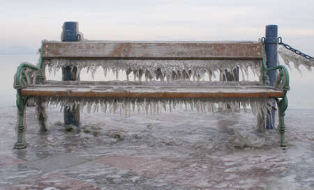 Icicles on a bench of a landing stageの写真素材