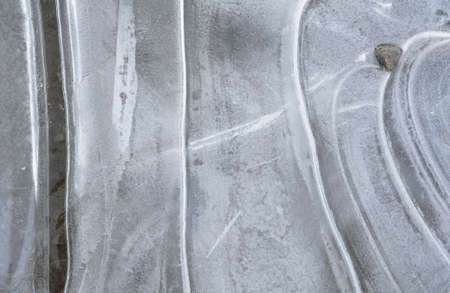 Ice on the lake surface forms beautiful patternの写真素材