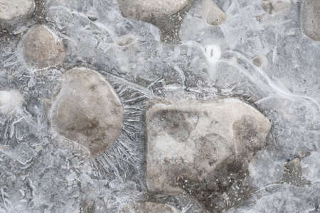 Ice covered stones on the beach