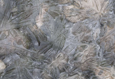 Ice on the lake surface forms beautiful patternの写真素材
