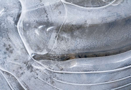 Ice on the lake surface forms beautiful patternの写真素材