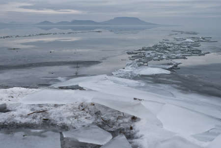 Winter landscape of a frozen lakeの写真素材
