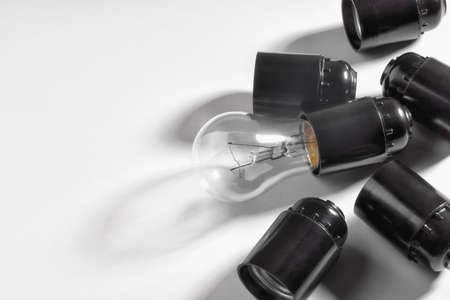 Electric light bulb and plinth on a light backgroundの写真素材