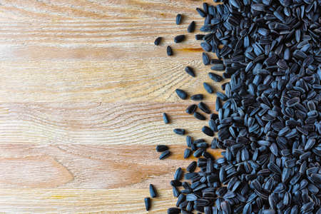 Sunflower seeds scattered on the surfaceの写真素材