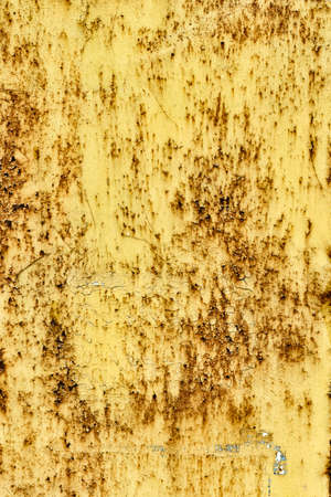 Textured rust creeping under the paint