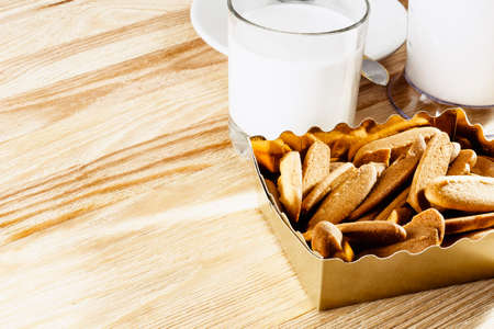 Fresh butter cookies in a cartonの写真素材