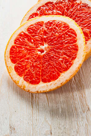 Grapefruit cut into rings on the tableの写真素材