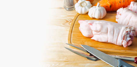 Pork legs lying on the kitchen tableの写真素材