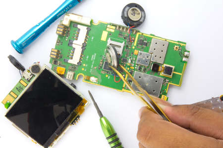 Mobile phone repair by electronic technician のeditorial素材