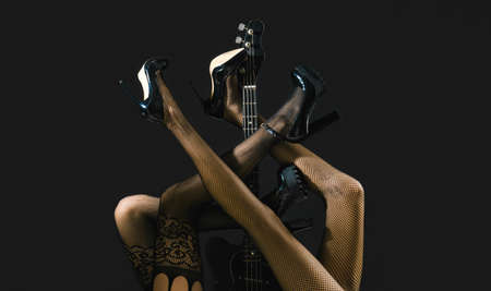 Sexy legs. Guitar, electric guitar. Fetish, sexy woman, electric guitar and legs, underwear. Fetish...