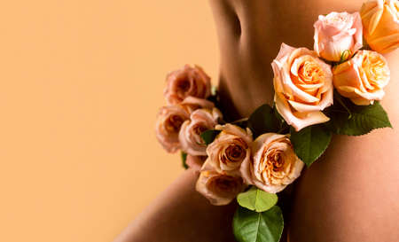 Woman dressed in white panties a flower, close-up. Sensual panties. female health, reproductive, gynecology isolated. Sensual girl. Gynecology and underwear, womens health. Female diseases, vaginaの写真素材