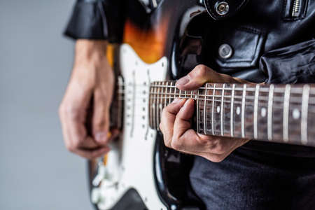 Electric guitar. Repetition of rock music band. Music festival. Man playing guitar. Close up hand playing guitar. Musician playing guitar, live musicの写真素材