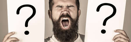 Question mark, symbol. Man screaming, emotion. Man question. Male with emotion scream, question marks. Screaming man.の写真素材
