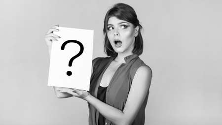 Concept - challenging issue, looking for the answer. Thinking woman. Girl question. Woman with doubtful expression and question marks. Getting answers, thinking. Question mark, symbolの写真素材