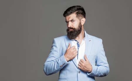 Elegant handsome man in suit. Handsome bearded businessman in classic suits. Man in suit. Male beard and mustache. Elegant man in business suit. Sexy male, brutal macho, hipster. Male in tuxedoの写真素材