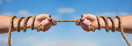 Two hands, helping hand, arm, friendship. Rope, cord. Hand holding a rope, climbing rope, strength...