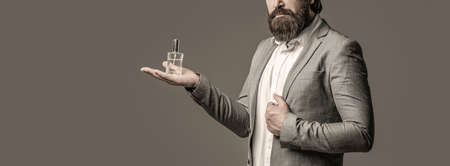 Perfume or cologne bottle, perfumery, cosmetics, scent cologne bottle, male holding cologne....