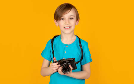 Boy using a cameras. Baby boy with camera. Cheerful smiling child holding a cameras. Little boy on a...