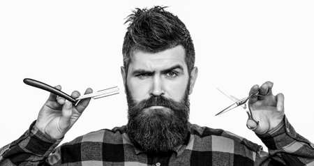 Bearded man, long beard, brutal, caucasian hipster with moustache. Mens haircut in barber shop....