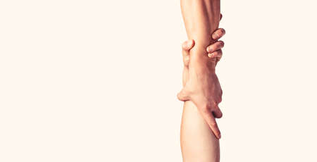 Rescue, helping gesture or hands. Two hands, helping arm of a friend, teamworkの写真素材