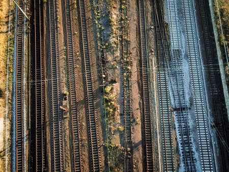 Infrastructure of track system with trains, switches, road bridges and railsの写真素材