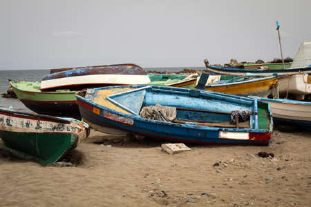 Old boats on the shoreの写真素材
