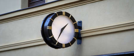 Clock at a house from a public place