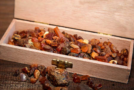 Amber in a wooden boxの写真素材
