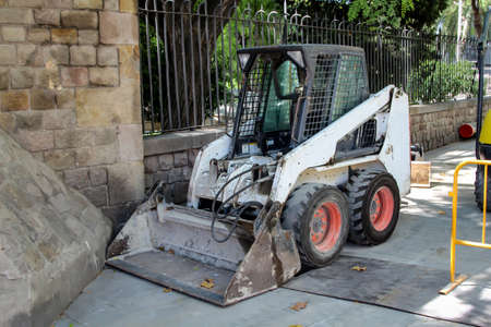 Excavator and excavator tools, excavator shovels on a construction site