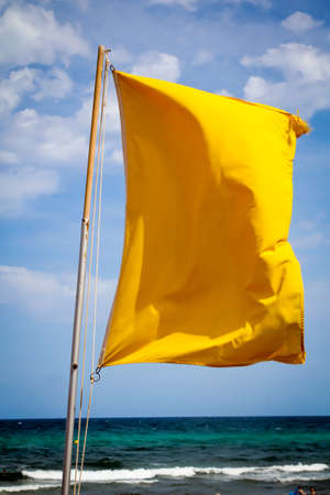 Flags on the beach indicate dangersの写真素材
