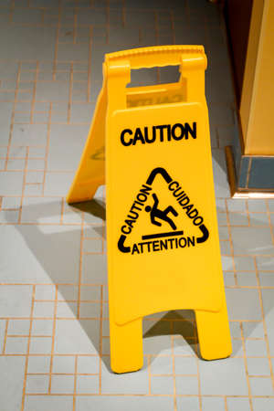 A caution slippery warning safety sign, yellow caution sign icon equipmentの写真素材