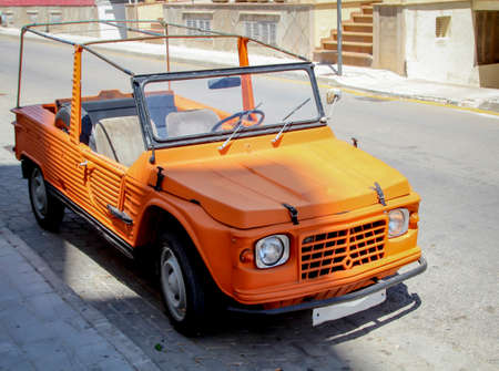 An old, vintage moderately styled cabriolet