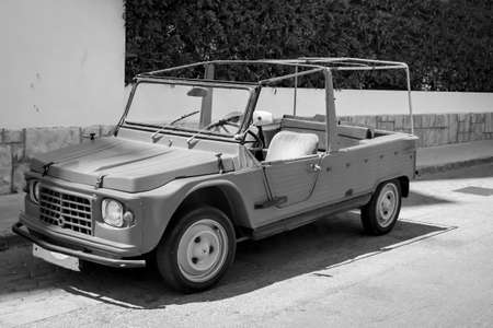 An old, vintage moderately styled cabriolet
