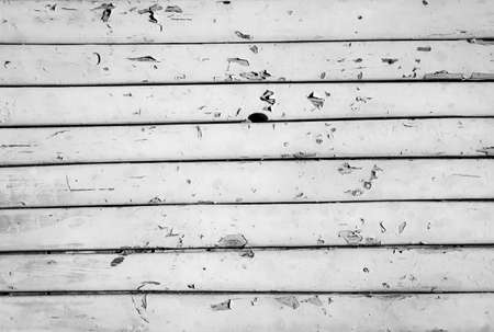 A wooden wall made of weathered wooden boards, texture of wood, textureの写真素材