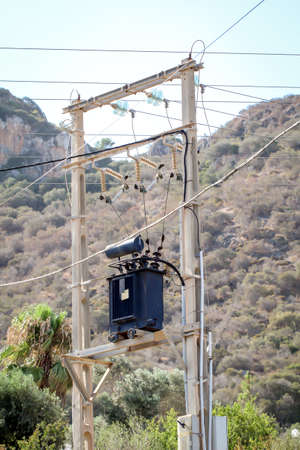 A mast, power pole at which the lines change direction