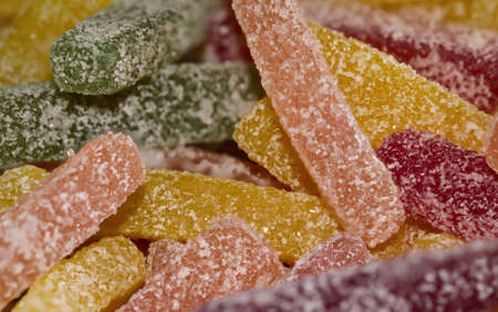 Sweet sour sticks gum coated with sugarの写真素材